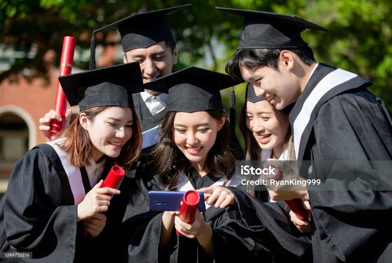 Students reviewing university admissions materials.