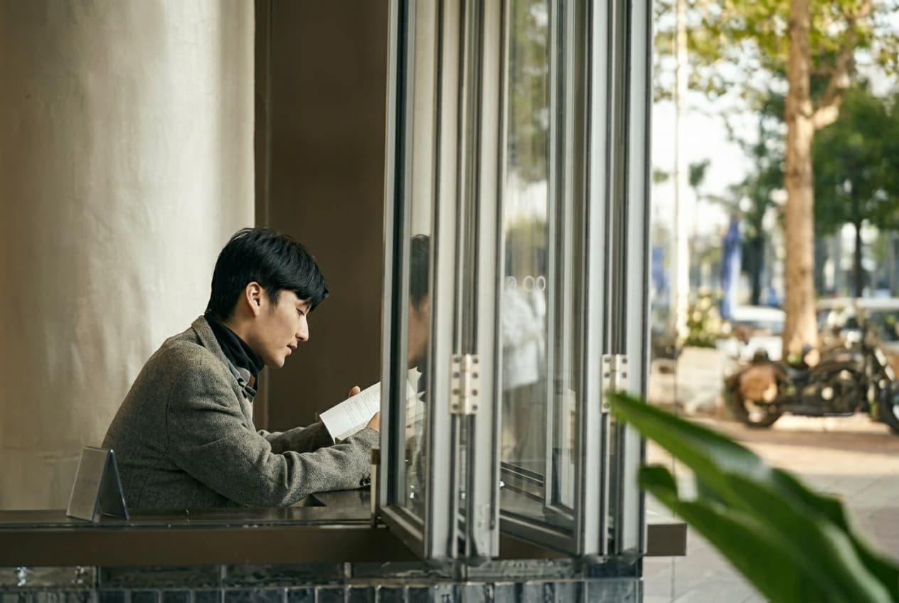 Student writing a study abroad application plan.